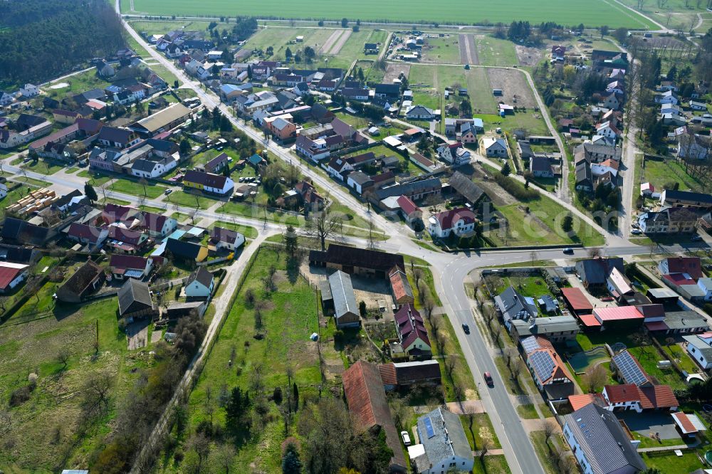 Aerial image Krahne - Agricultural land and field boundaries surround the settlement area of the village in Krahne in the state Brandenburg, Germany