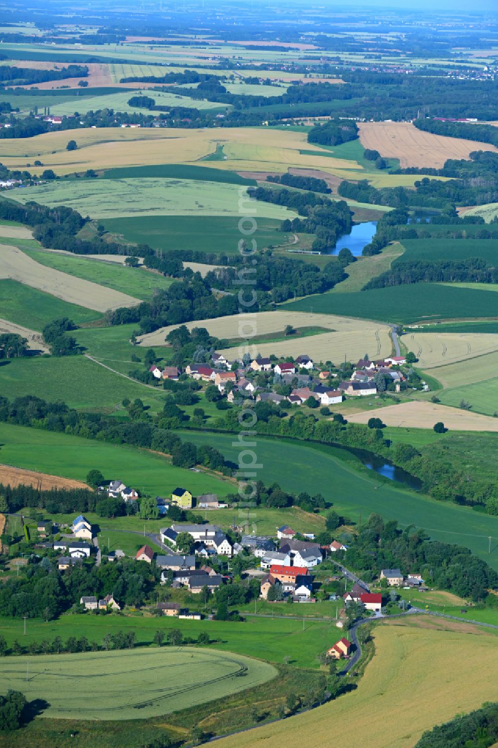 Kralapp from above - Agricultural land and field boundaries surround the settlement area of the village in Kralapp in the state Saxony, Germany