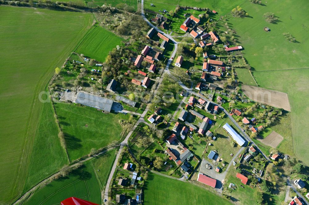 Krangen from the bird's eye view: Agricultural land and field boundaries surround the settlement area of the village on street Dorfstrasse in Krangen in the state Brandenburg, Germany