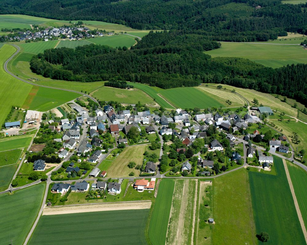 Krastel from above - Agricultural land and field boundaries surround the settlement area of the village in Krastel in the state Rhineland-Palatinate, Germany