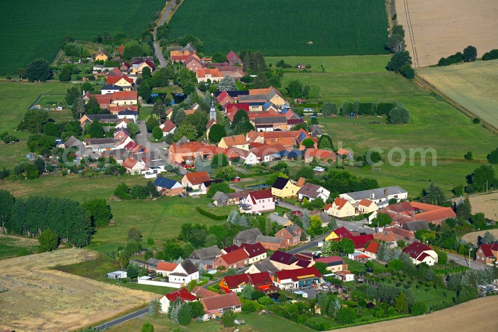 Aerial image Körba - Agricultural land and field boundaries surround the settlement area of the village in Koerba in the state Brandenburg, Germany