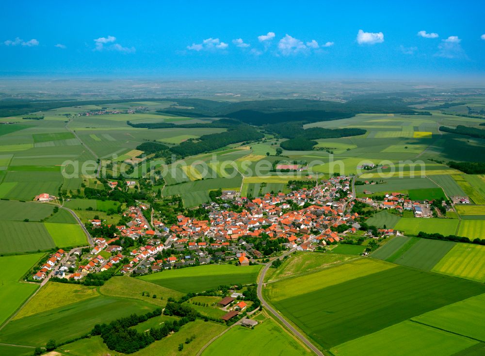 Aerial image Kriegsfeld - Agricultural land and field boundaries surround the settlement area of the village in Kriegsfeld in the state Rhineland-Palatinate, Germany