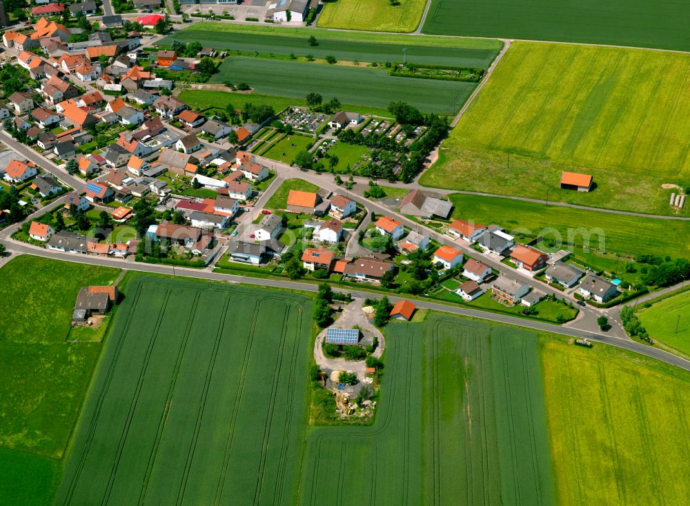 Kriegsfeld from above - Agricultural land and field boundaries surround the settlement area of the village in Kriegsfeld in the state Rhineland-Palatinate, Germany