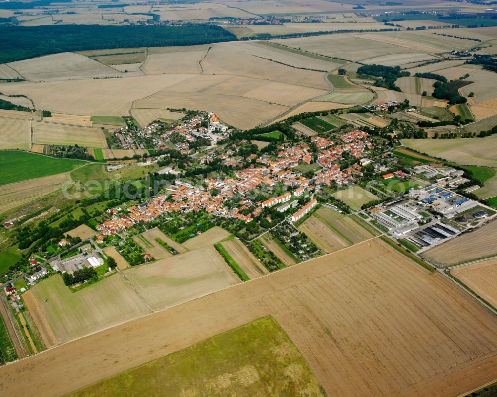 Aerial photograph Körner - Agricultural land and field boundaries surround the settlement area of the village in Körner in the state Thuringia, Germany