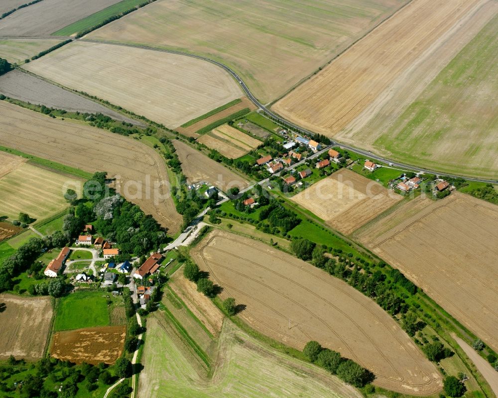 Körner from the bird's eye view: Agricultural land and field boundaries surround the settlement area of the village in Körner in the state Thuringia, Germany