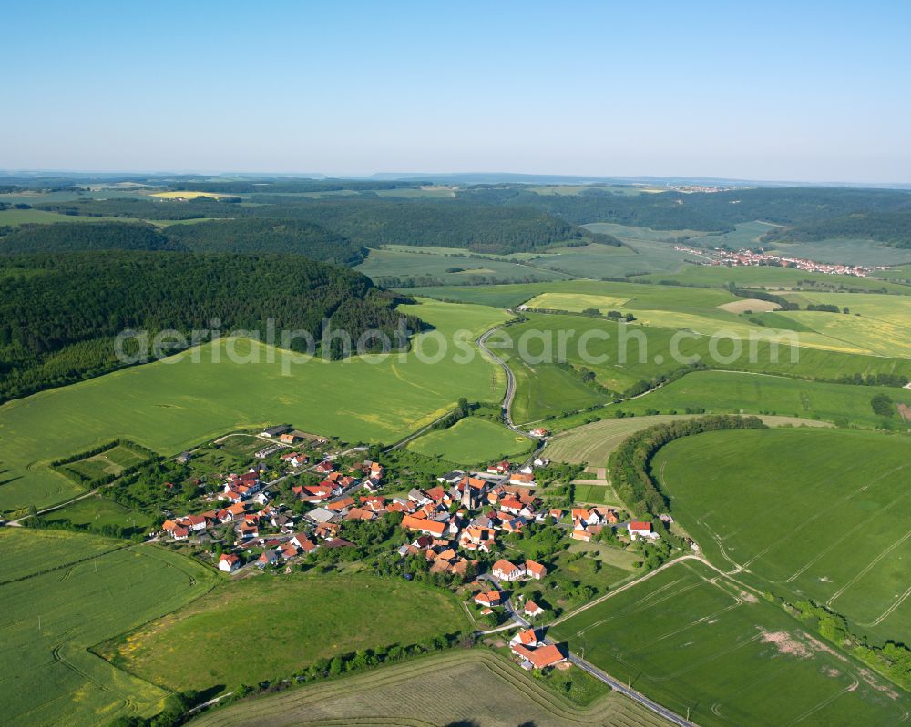 Aerial image Krombach - Agricultural land and field boundaries surround the settlement area of the village in Krombach in the state Thuringia, Germany