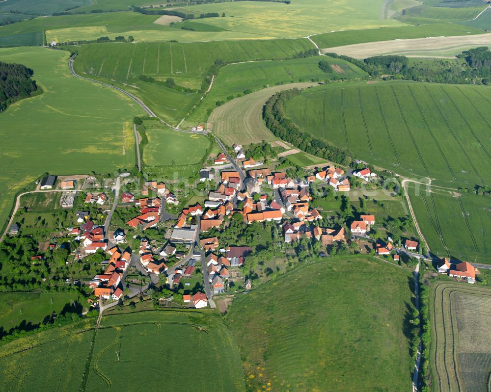 Aerial photograph Krombach - Agricultural land and field boundaries surround the settlement area of the village in Krombach in the state Thuringia, Germany