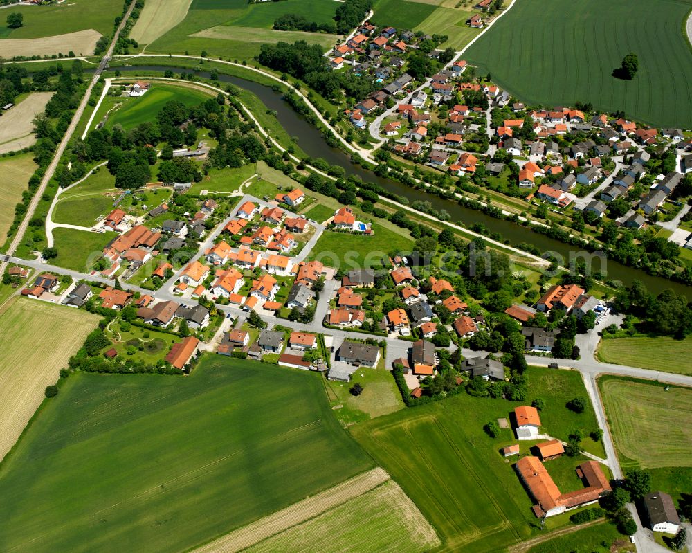 Kronberg from above - Agricultural land and field boundaries surround the settlement area of the village in Kronberg in the state Bavaria, Germany