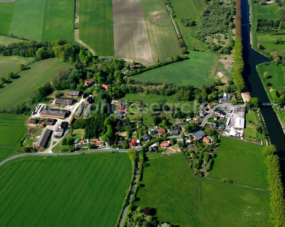 Krummesse from above - Agricultural land and field boundaries surround the settlement area of the village in Krummesse in the state Schleswig-Holstein, Germany