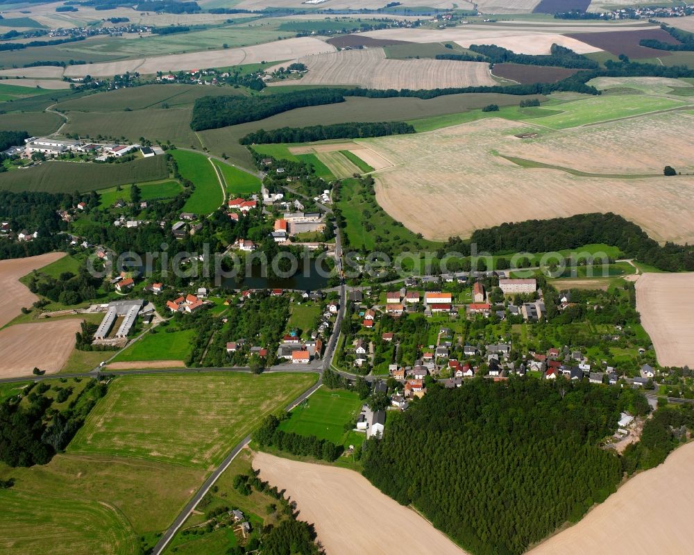 Köttwitzsch from the bird's eye view: Agricultural land and field boundaries surround the settlement area of the village in Köttwitzsch in the state Saxony, Germany