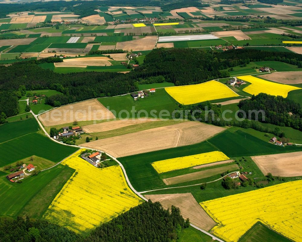 Aerial image Kuffing - Agricultural land and field boundaries surround the settlement area of the village in Kuffing in the state Bavaria, Germany