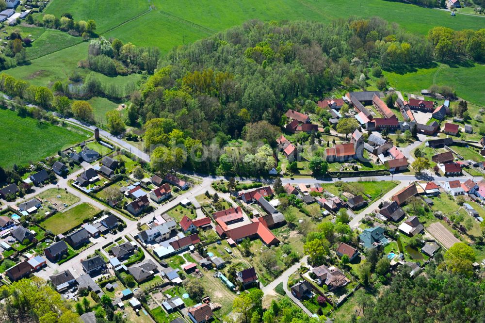 Kuhfelde from the bird's eye view: Agricultural land and field boundaries surround the settlement area of the village in Kuhfelde in the state Saxony-Anhalt, Germany