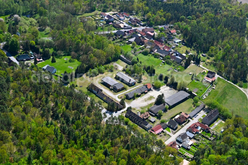 Kuhfelde from the bird's eye view: Agricultural land and field boundaries surround the settlement area of the village in Kuhfelde in the state Saxony-Anhalt, Germany