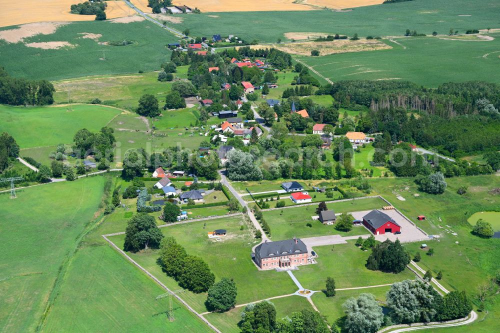 Lalendorf from above - Agricultural land and field boundaries surround the settlement area of the village in Lalendorf in the state Mecklenburg - Western Pomerania, Germany