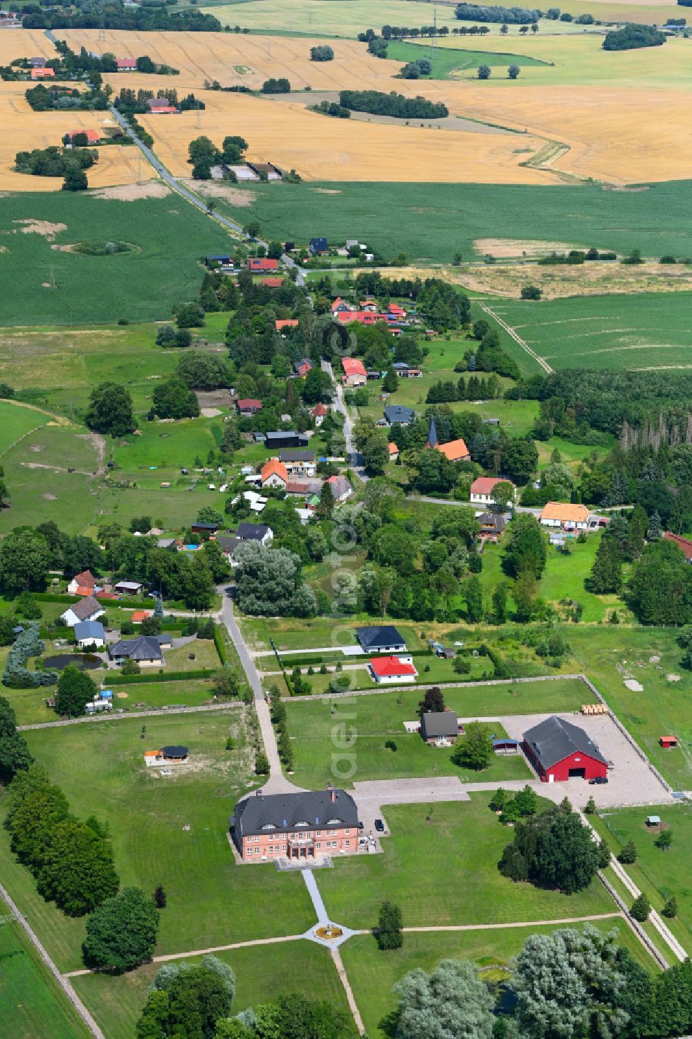 Lalendorf from the bird's eye view: Agricultural land and field boundaries surround the settlement area of the village in Lalendorf in the state Mecklenburg - Western Pomerania, Germany