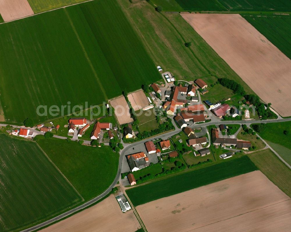 Lammelbach from the bird's eye view: Agricultural land and field boundaries surround the settlement area of the village in Lammelbach in the state Bavaria, Germany