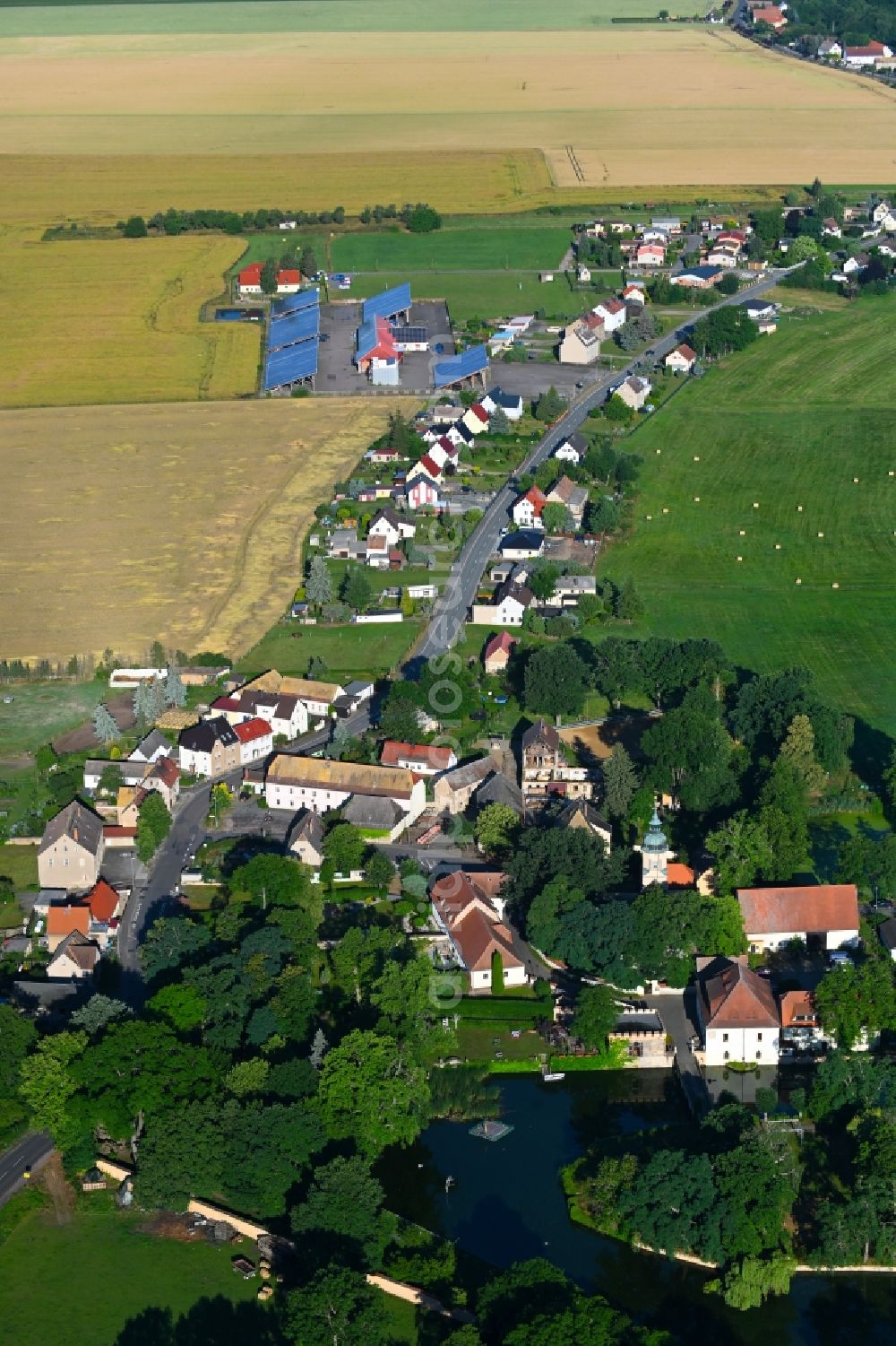 Aerial image Lampertswalde - Agricultural land and field boundaries surround the settlement area of the village in Lampertswalde in the state Saxony, Germany