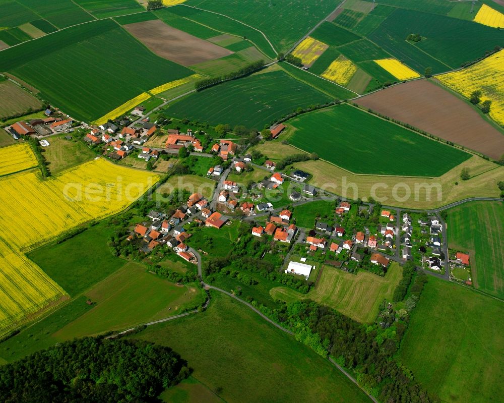 Aerial image Landershausen - Agricultural land and field boundaries surround the settlement area of the village in Landershausen in the state Hesse, Germany