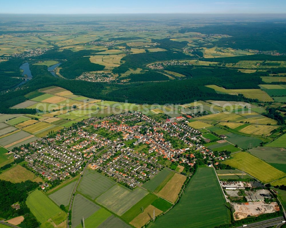 Aerial photograph Landwehrhagen - Agricultural land and field boundaries surround the settlement area of the village in Landwehrhagen in the state Lower Saxony, Germany