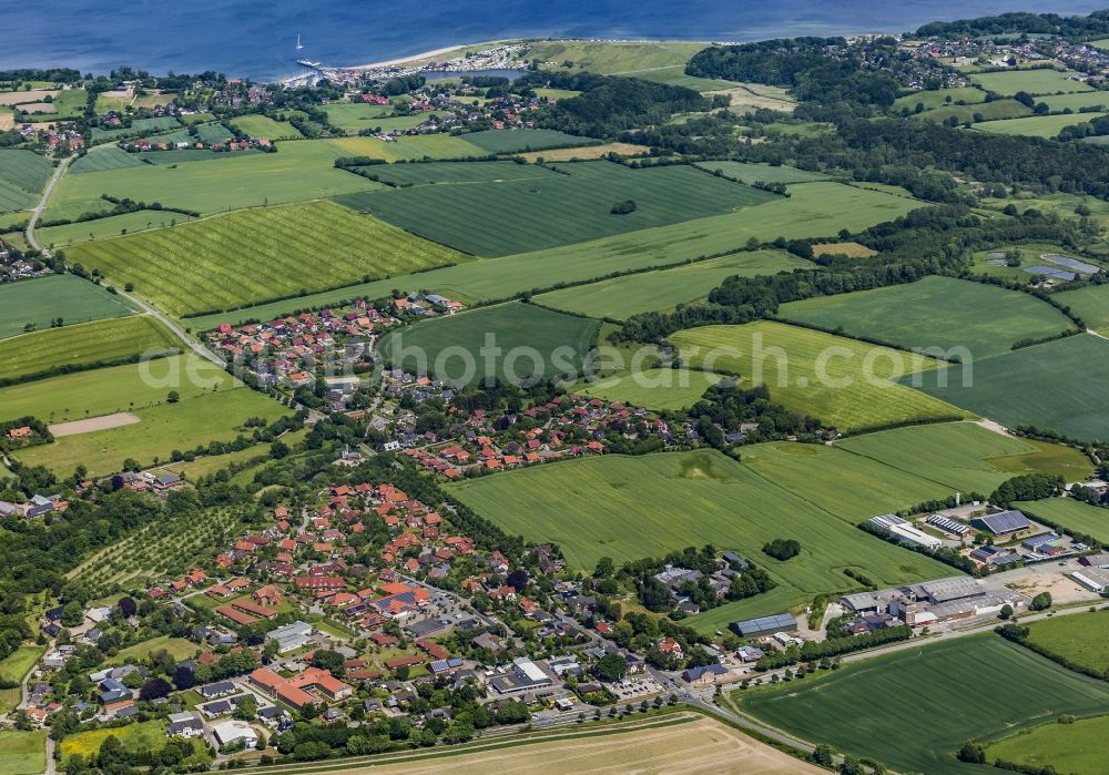 Langballig from above - Agricultural land and field boundaries surround the settlement area of the village in Langballig in the state Schleswig-Holstein, Germany