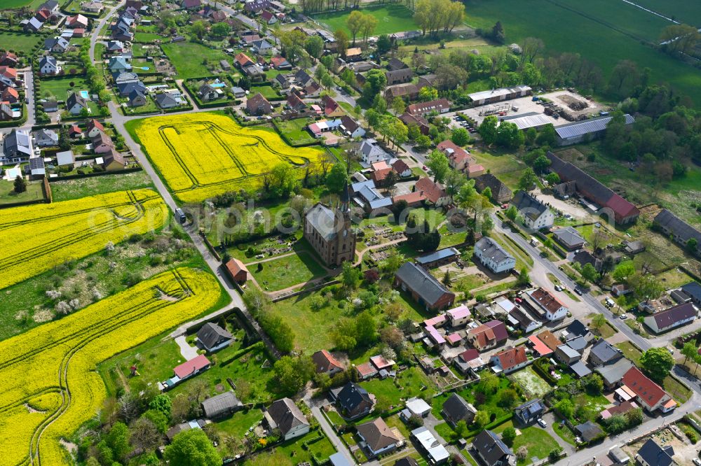 Aerial image Langen - Agricultural land and field boundaries surround the settlement area of the village in Langen in the state Brandenburg, Germany