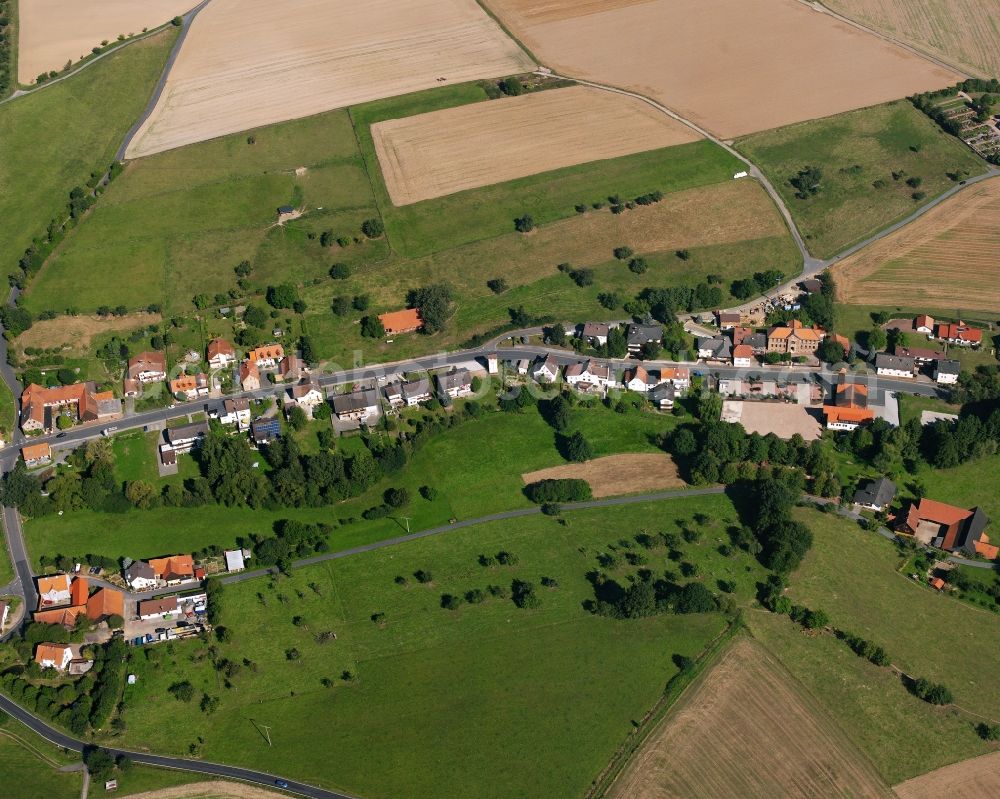 Aerial photograph Langen-Brombach - Agricultural land and field boundaries surround the settlement area of the village in Langen-Brombach in the state Hesse, Germany