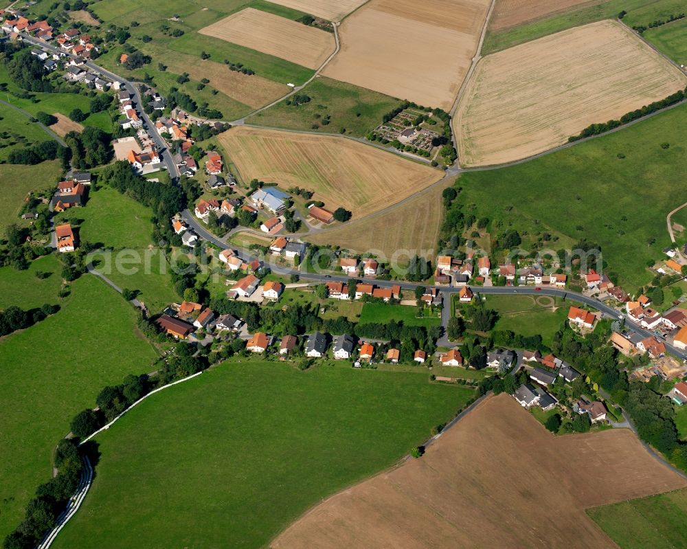 Aerial image Langen-Brombach - Agricultural land and field boundaries surround the settlement area of the village in Langen-Brombach in the state Hesse, Germany