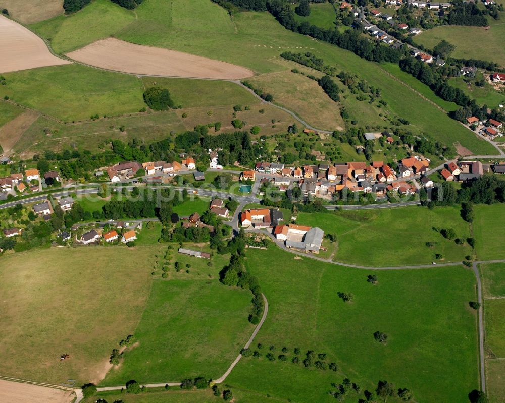 Aerial photograph Langen-Brombach - Agricultural land and field boundaries surround the settlement area of the village in Langen-Brombach in the state Hesse, Germany