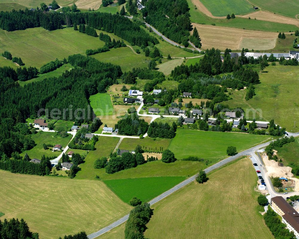 Langenbach from the bird's eye view: Agricultural land and field boundaries surround the settlement area of the village in Langenbach in the state Bavaria, Germany