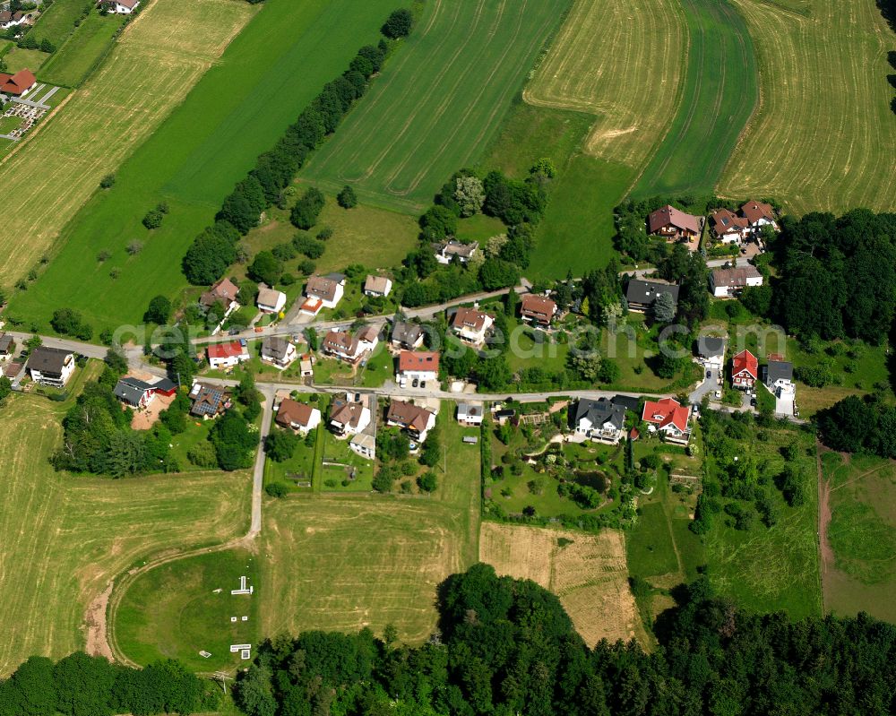 Aerial photograph Langenbrand - Agricultural land and field boundaries surround the settlement area of the village in Langenbrand in the state Baden-Wuerttemberg, Germany