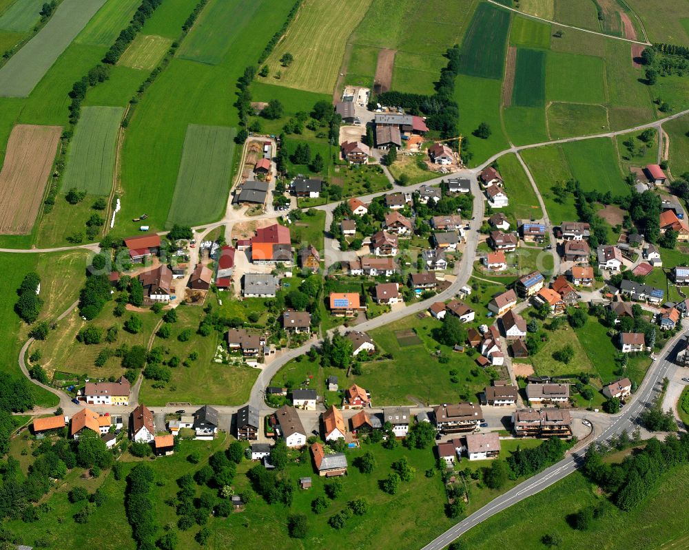 Aerial image Langenbrand - Agricultural land and field boundaries surround the settlement area of the village in Langenbrand in the state Baden-Wuerttemberg, Germany