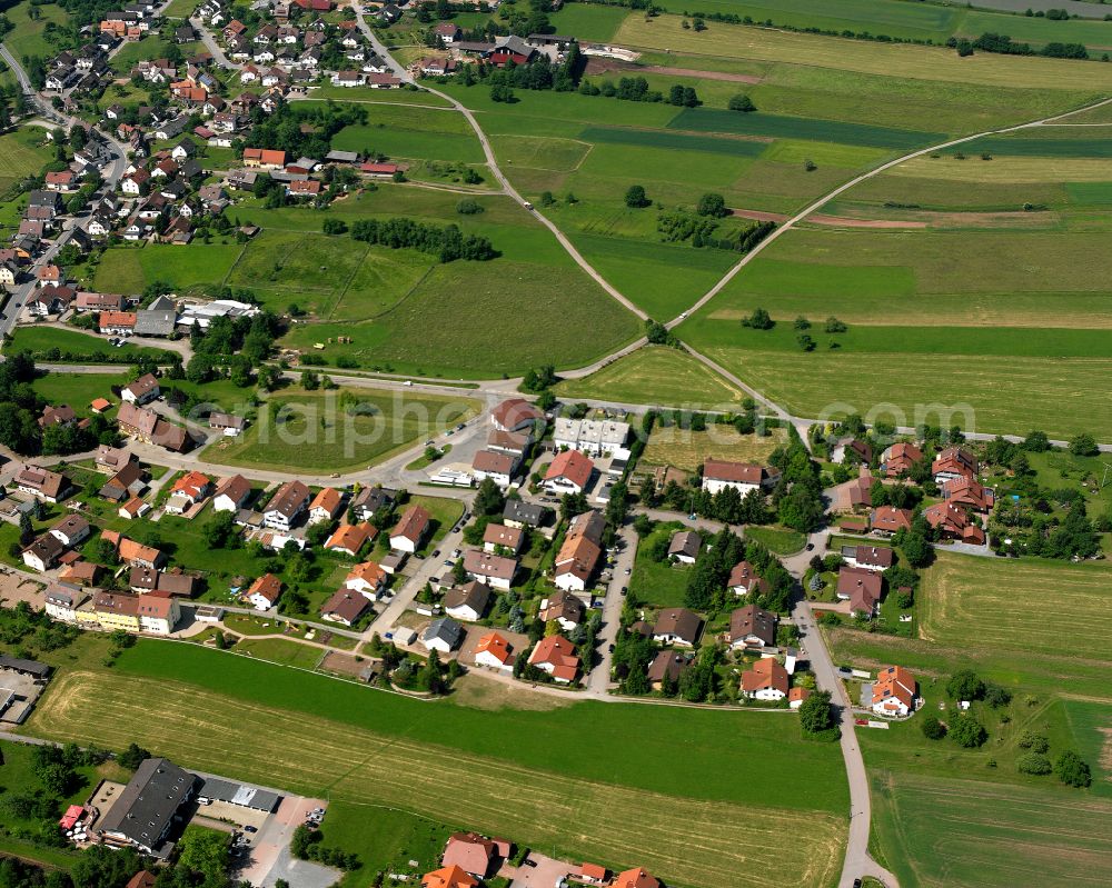 Aerial photograph Langenbrand - Agricultural land and field boundaries surround the settlement area of the village in Langenbrand in the state Baden-Wuerttemberg, Germany