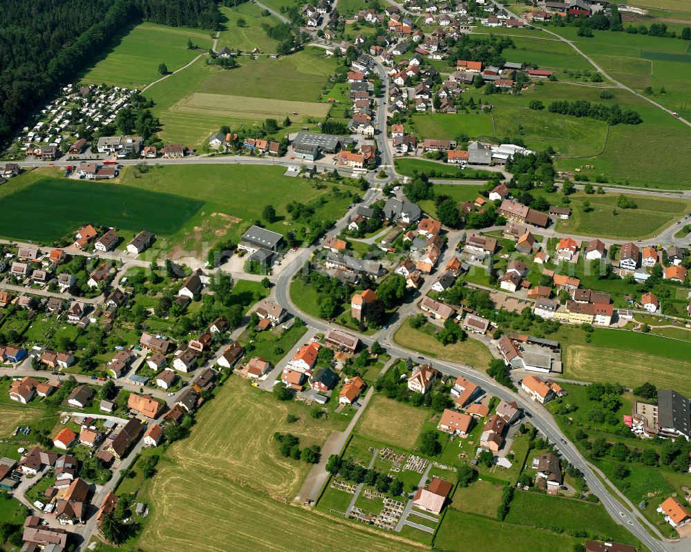 Langenbrand from above - Agricultural land and field boundaries surround the settlement area of the village in Langenbrand in the state Baden-Wuerttemberg, Germany