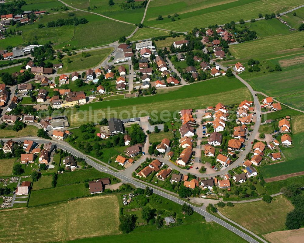 Aerial image Langenbrand - Agricultural land and field boundaries surround the settlement area of the village in Langenbrand in the state Baden-Wuerttemberg, Germany