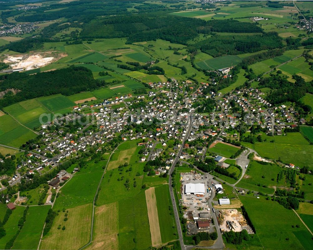 Aerial image Langendernbach - Agricultural land and field boundaries surround the settlement area of the village in Langendernbach in the state Hesse, Germany