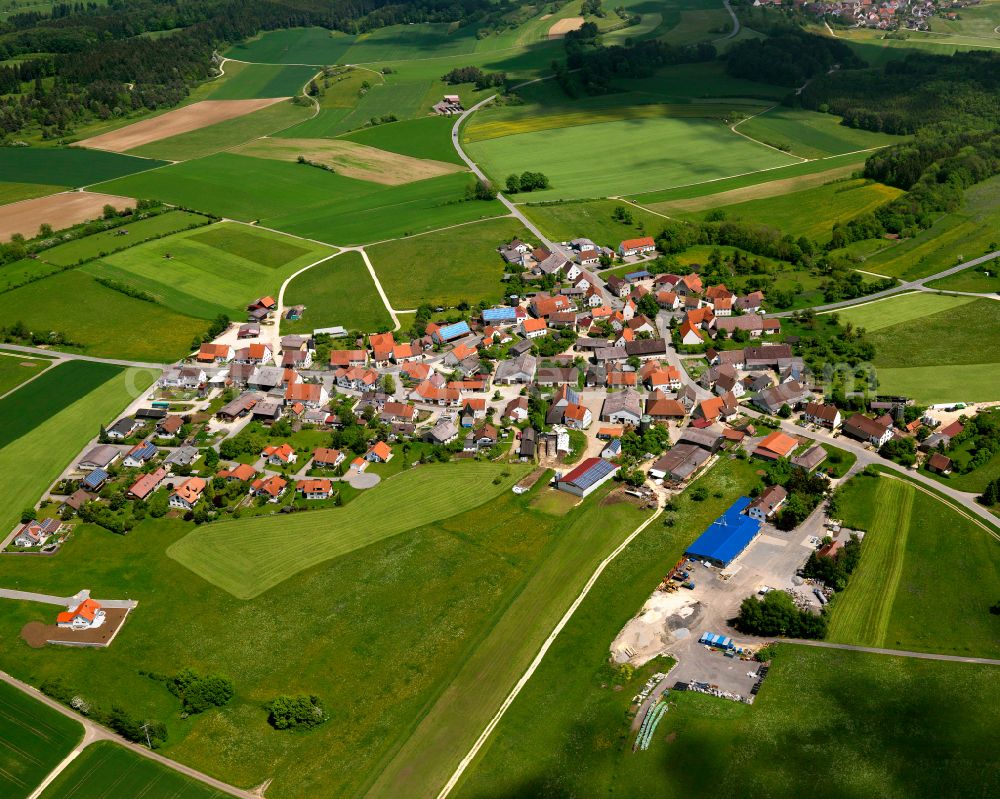 Aerial image Langenenslingen - Agricultural land and field boundaries surround the settlement area of the village in Langenenslingen in the state Baden-Wuerttemberg, Germany