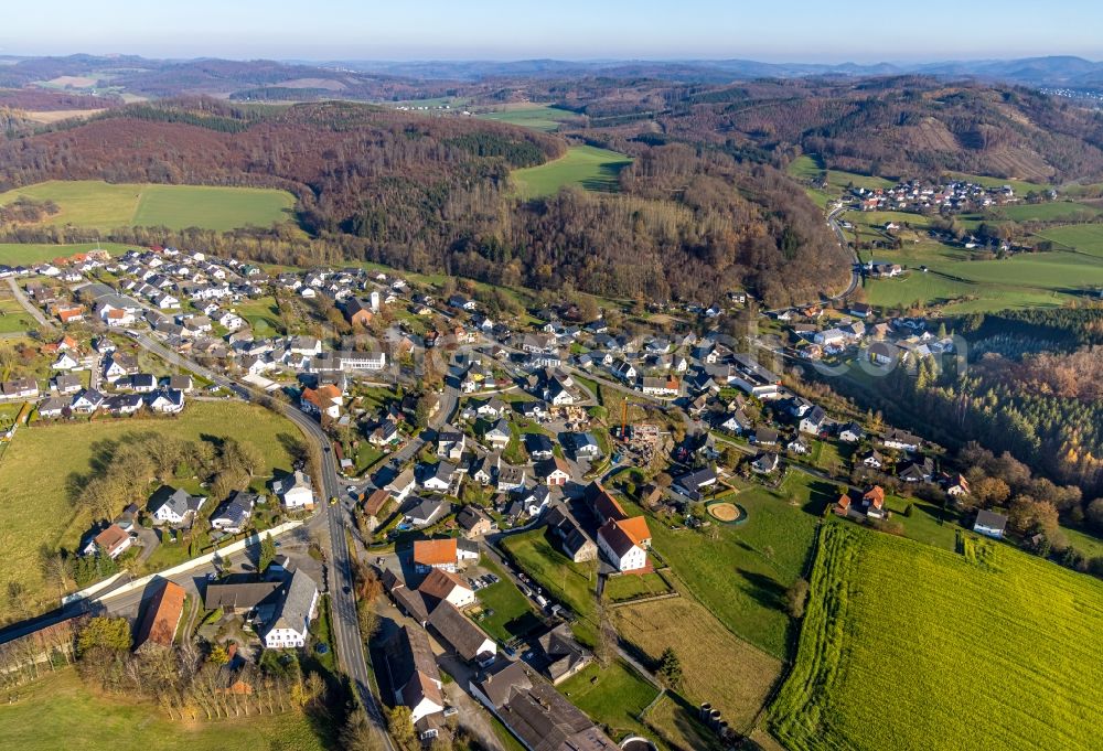 Aerial image Langenholthausen - Agricultural land and field boundaries surround the settlement area of the village in Langenholthausen in the state North Rhine-Westphalia, Germany