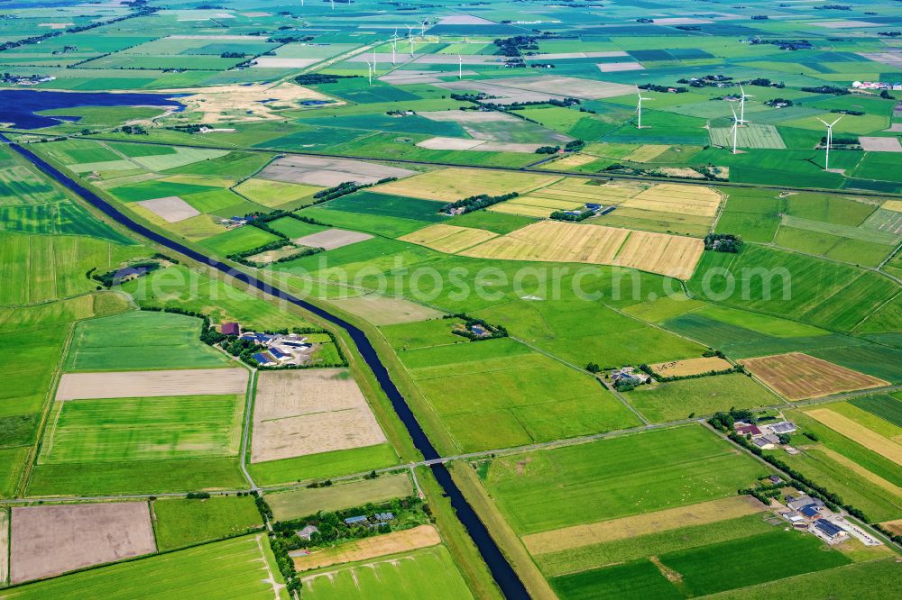 Aerial photograph Langenhorn - Agricultural land and field boundaries surround the settlement area of the village in Langenhorn in the state Schleswig-Holstein, Germany