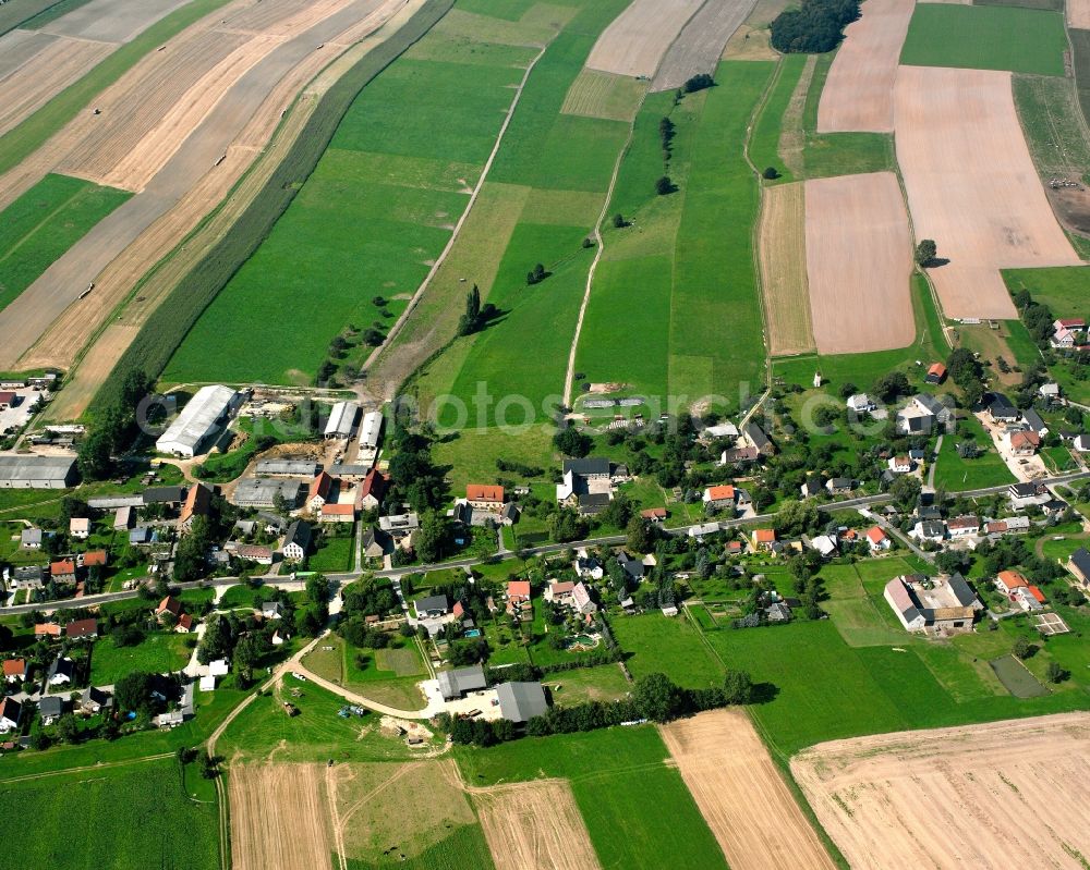 Aerial image Langenleuba-Oberhain - Agricultural land and field boundaries surround the settlement area of the village in Langenleuba-Oberhain in the state Saxony, Germany