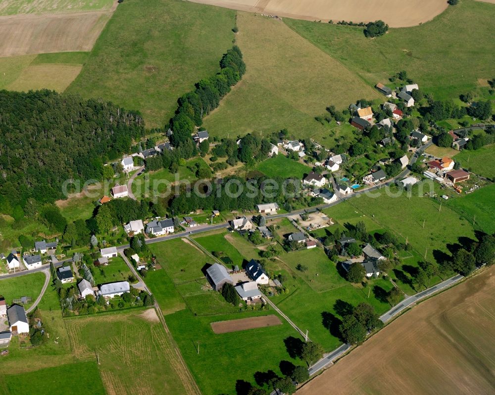 Aerial photograph Langenstriegis - Agricultural land and field boundaries surround the settlement area of the village in Langenstriegis in the state Saxony, Germany