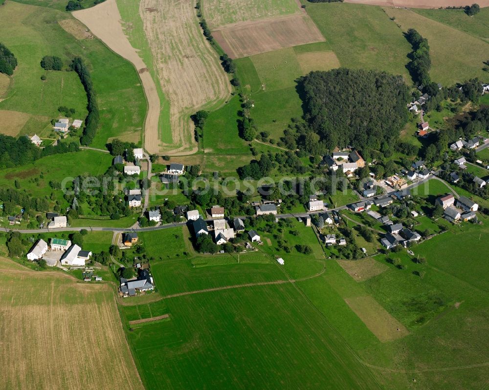 Langenstriegis from above - Agricultural land and field boundaries surround the settlement area of the village in Langenstriegis in the state Saxony, Germany