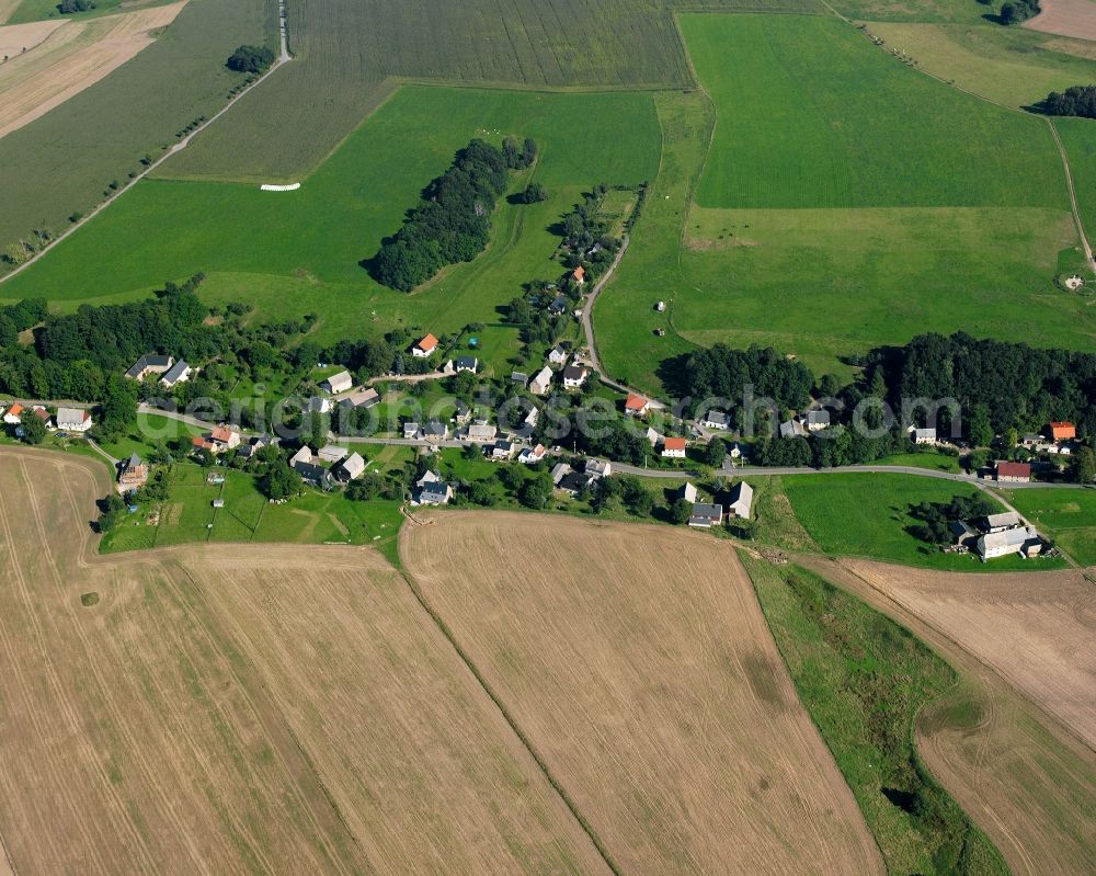 Aerial image Langenstriegis - Agricultural land and field boundaries surround the settlement area of the village in Langenstriegis in the state Saxony, Germany