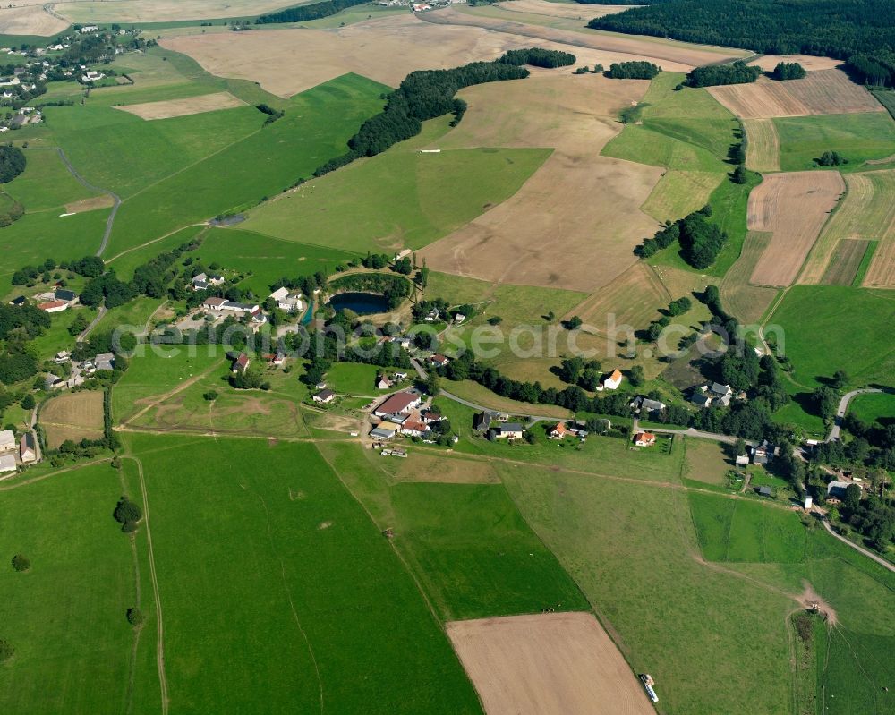 Aerial photograph Langenstriegis - Agricultural land and field boundaries surround the settlement area of the village in Langenstriegis in the state Saxony, Germany