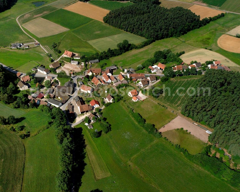 Lanzendorf from the bird's eye view: Agricultural land and field boundaries surround the settlement area of the village in Lanzendorf in the state Bavaria, Germany