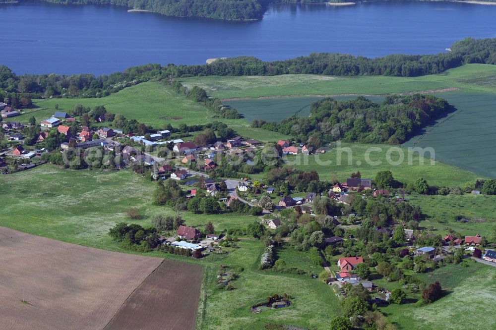 Aerial photograph Lassahn - Agricultural land and field boundaries surround the settlement area of the village in Lassahn in the state Mecklenburg - Western Pomerania, Germany