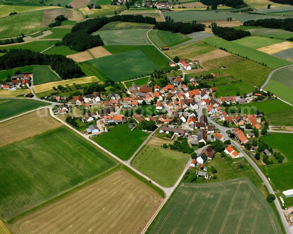 Aerial photograph Lattenbuch - Agricultural land and field boundaries surround the settlement area of the village in Lattenbuch in the state Bavaria, Germany