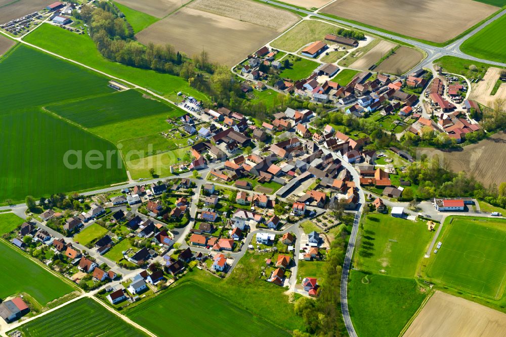 Aerial image Laub - Agricultural land and field boundaries surround the settlement area of the village in Laub in the state Bavaria, Germany