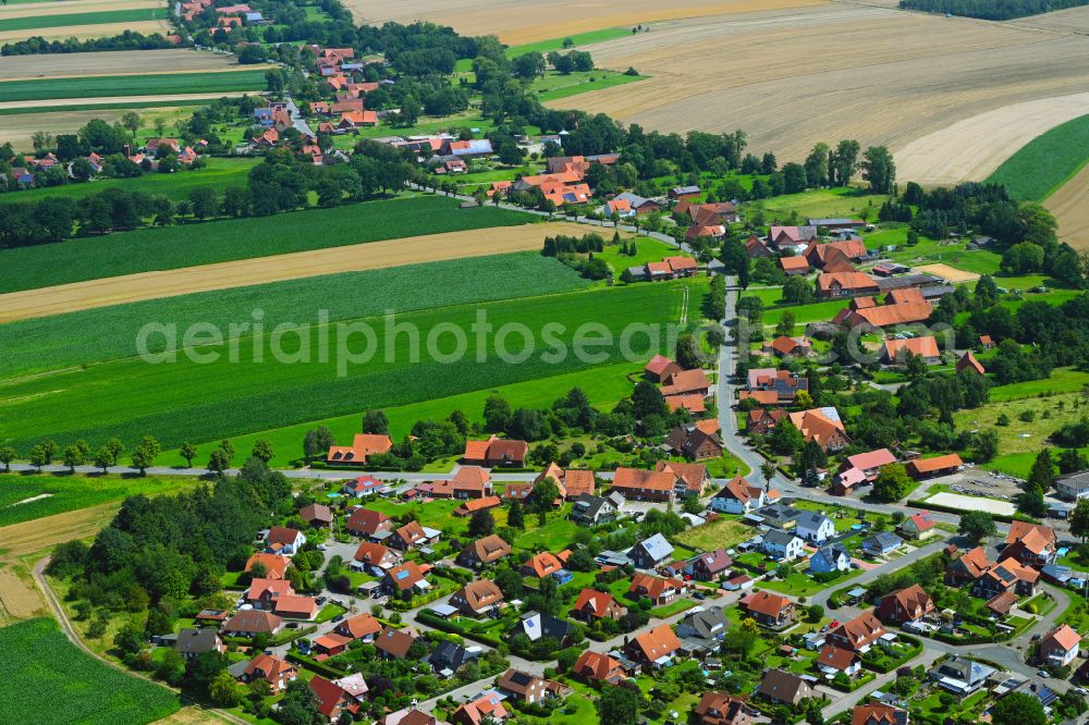 Aerial photograph Lauenhagen - Agricultural land and field boundaries surround the settlement area of the village in Lauenhagen in the state Lower Saxony, Germany