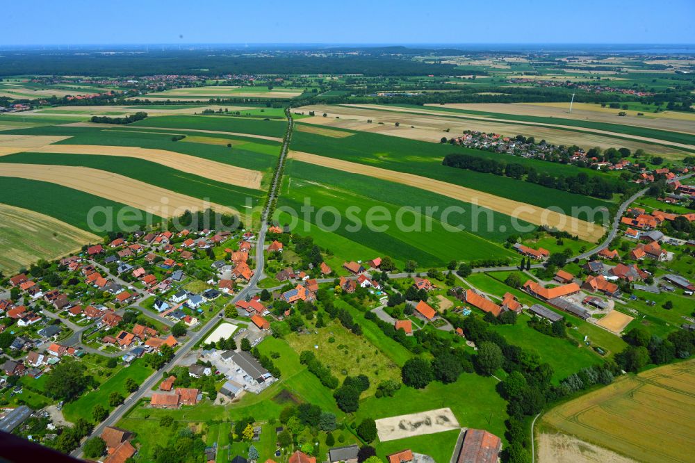 Lauenhagen from above - Agricultural land and field boundaries surround the settlement area of the village in Lauenhagen in the state Lower Saxony, Germany