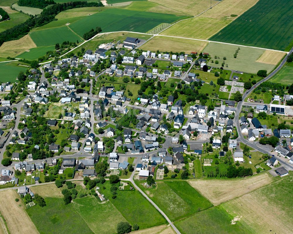 Laufersweiler from the bird's eye view: Agricultural land and field boundaries surround the settlement area of the village in Laufersweiler in the state Rhineland-Palatinate, Germany